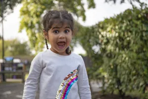 Small child shouting with joy