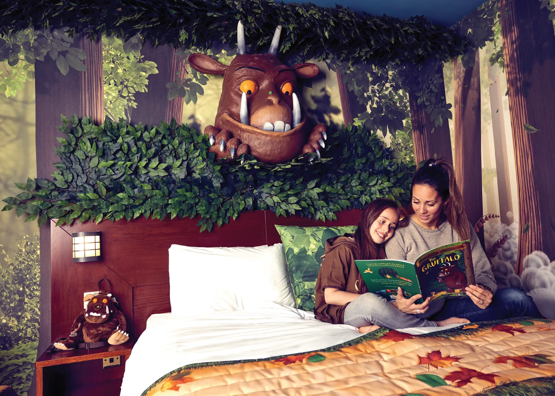 Mother and Daughter reading a book in The Gruffalo Room at Chessington World of Adventures Resort