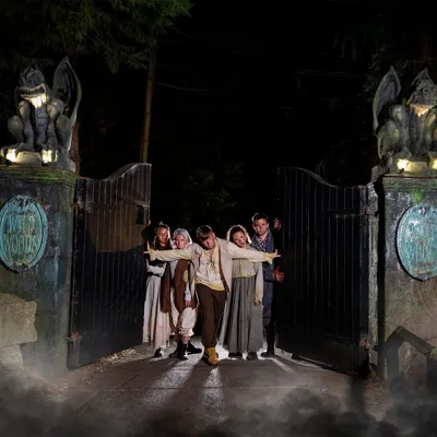 Halloween Villagers walking through gate at night